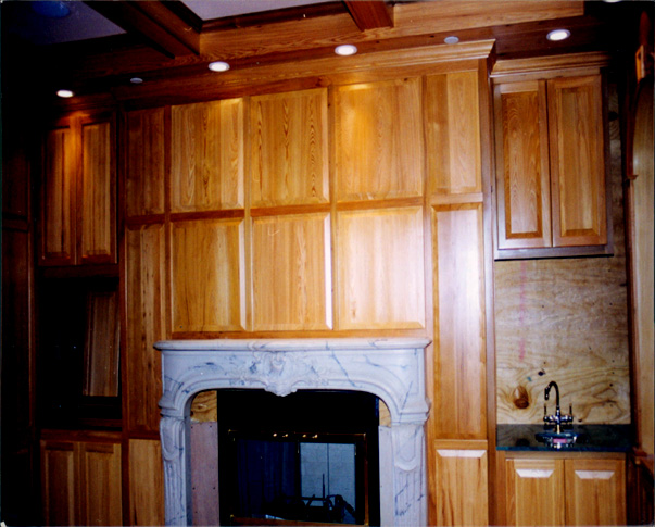 Treehouse Woodworking raised_panel_fireplace_wall1.jpg